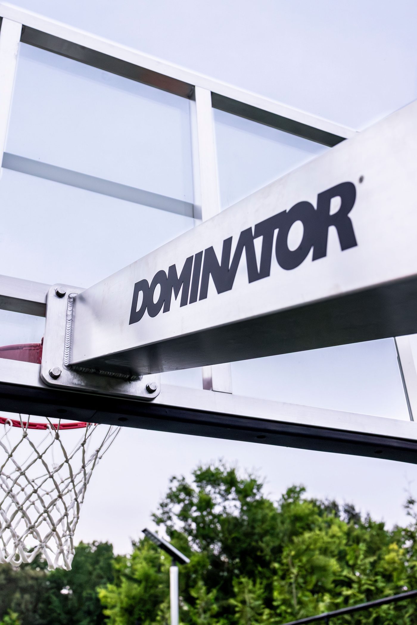 Dominator basketball hoop with branded backboard arm