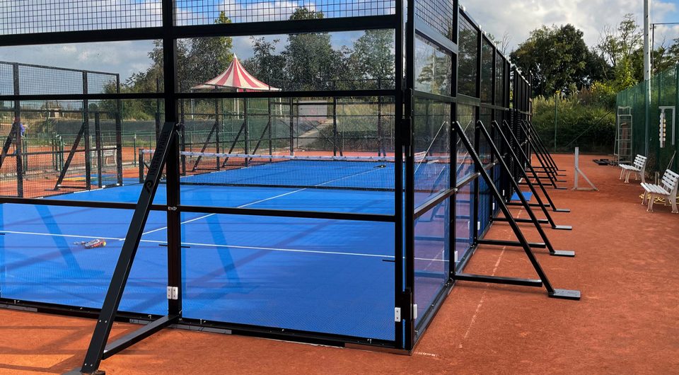 Padel court with glass walls and steel frame
